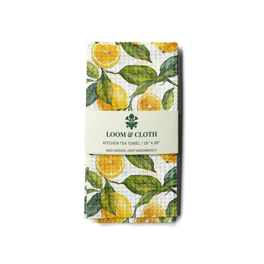 kitchen tea towel with lemon design on a white background