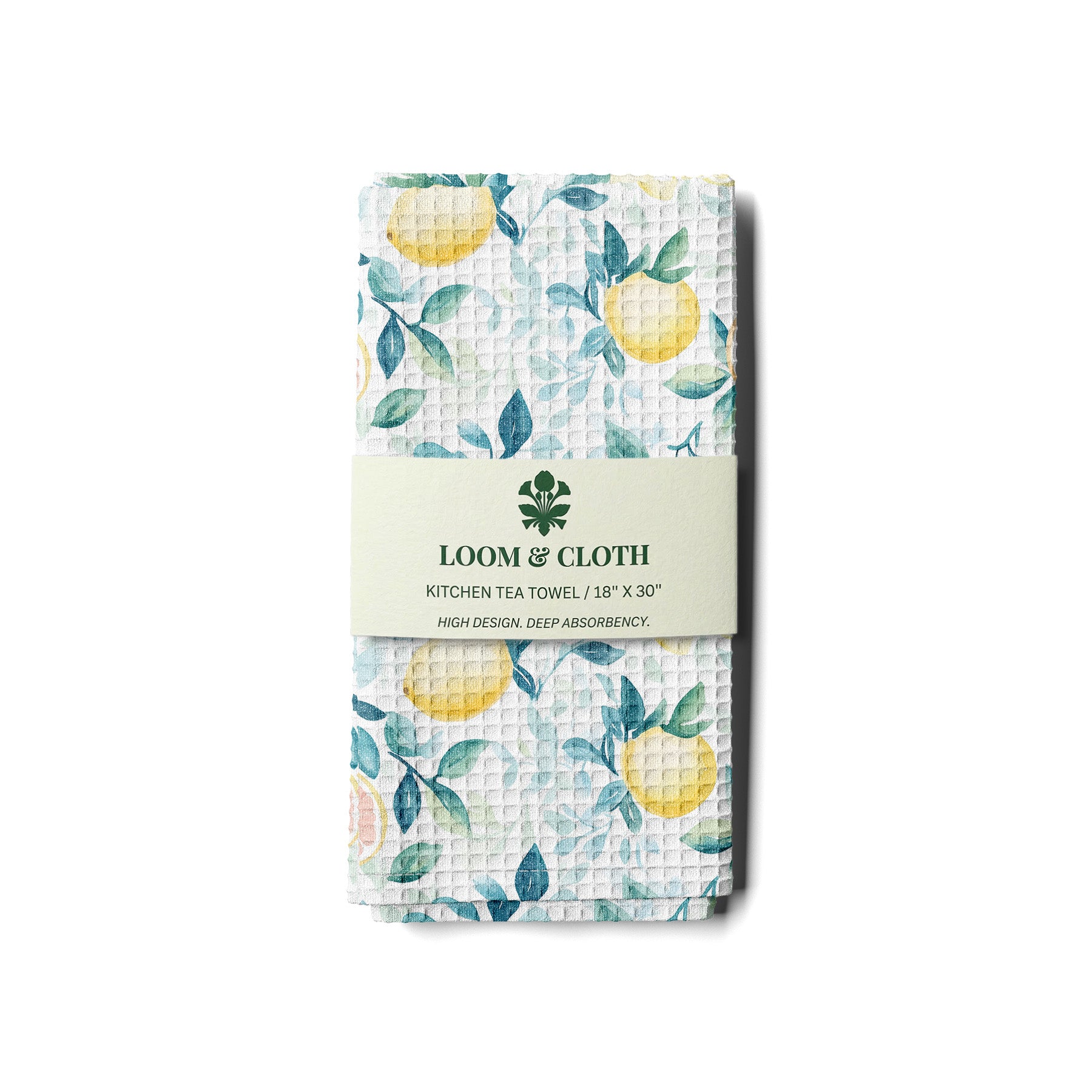 kitchen tea towel with lemon pattern and Loom & Cloth branding on a white background