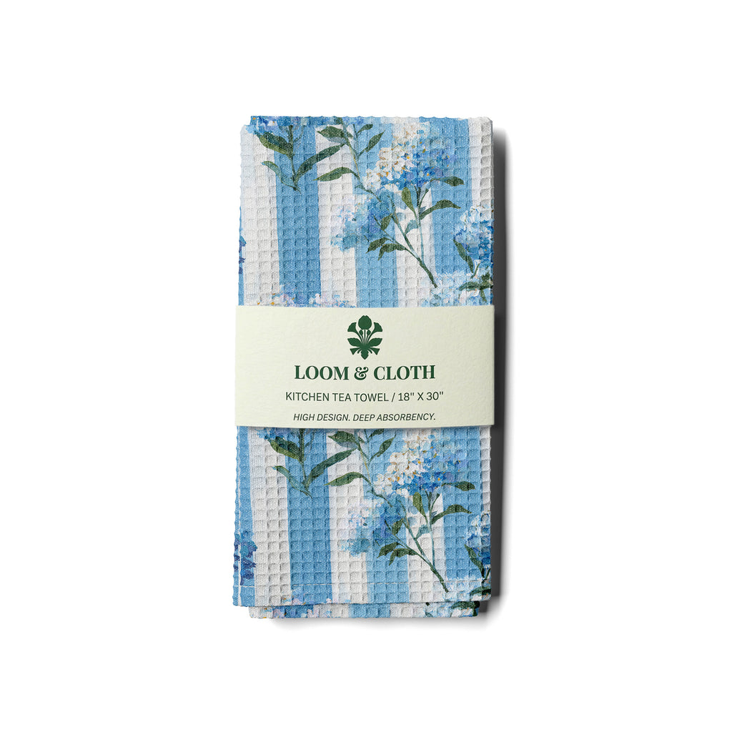 kitchen tea towel with floral design and 'Loom & Cloth' branding on a white background