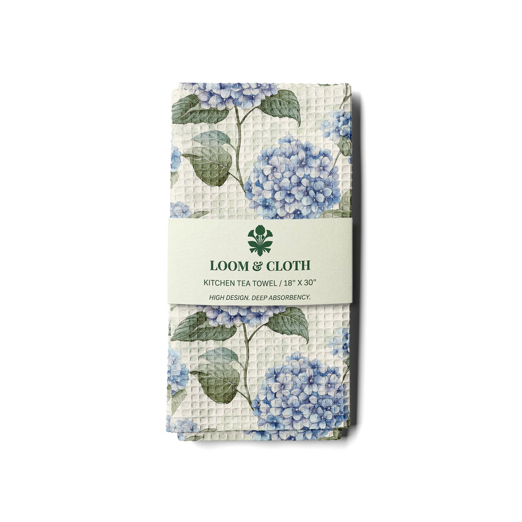 kitchen tea towel with floral design and 'Loom & Cloth' branding on a white background