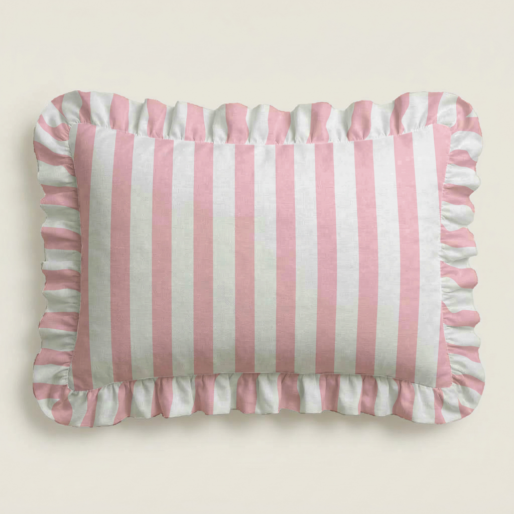 Rectangular pillow with pink and white vertical stripes on a beige background