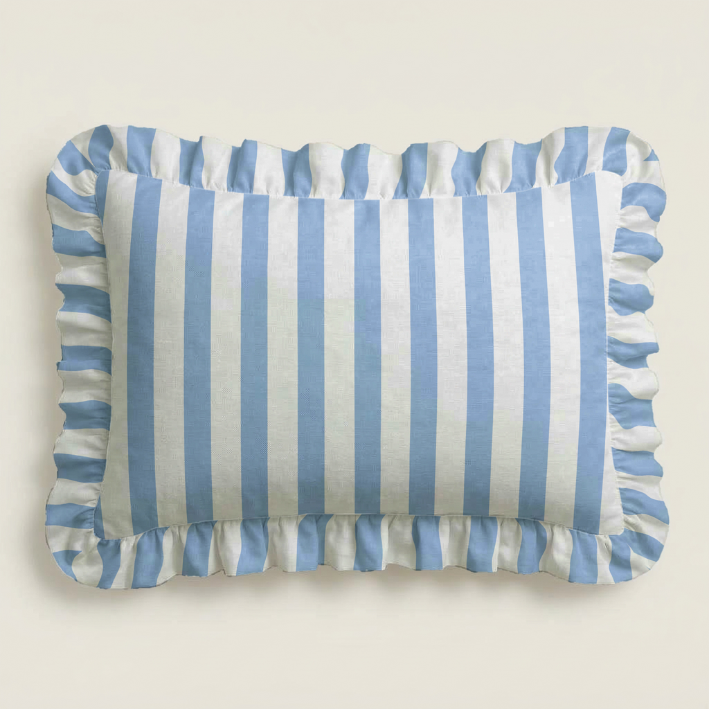 Rectangular pillow with blue and white striped pattern on a beige background