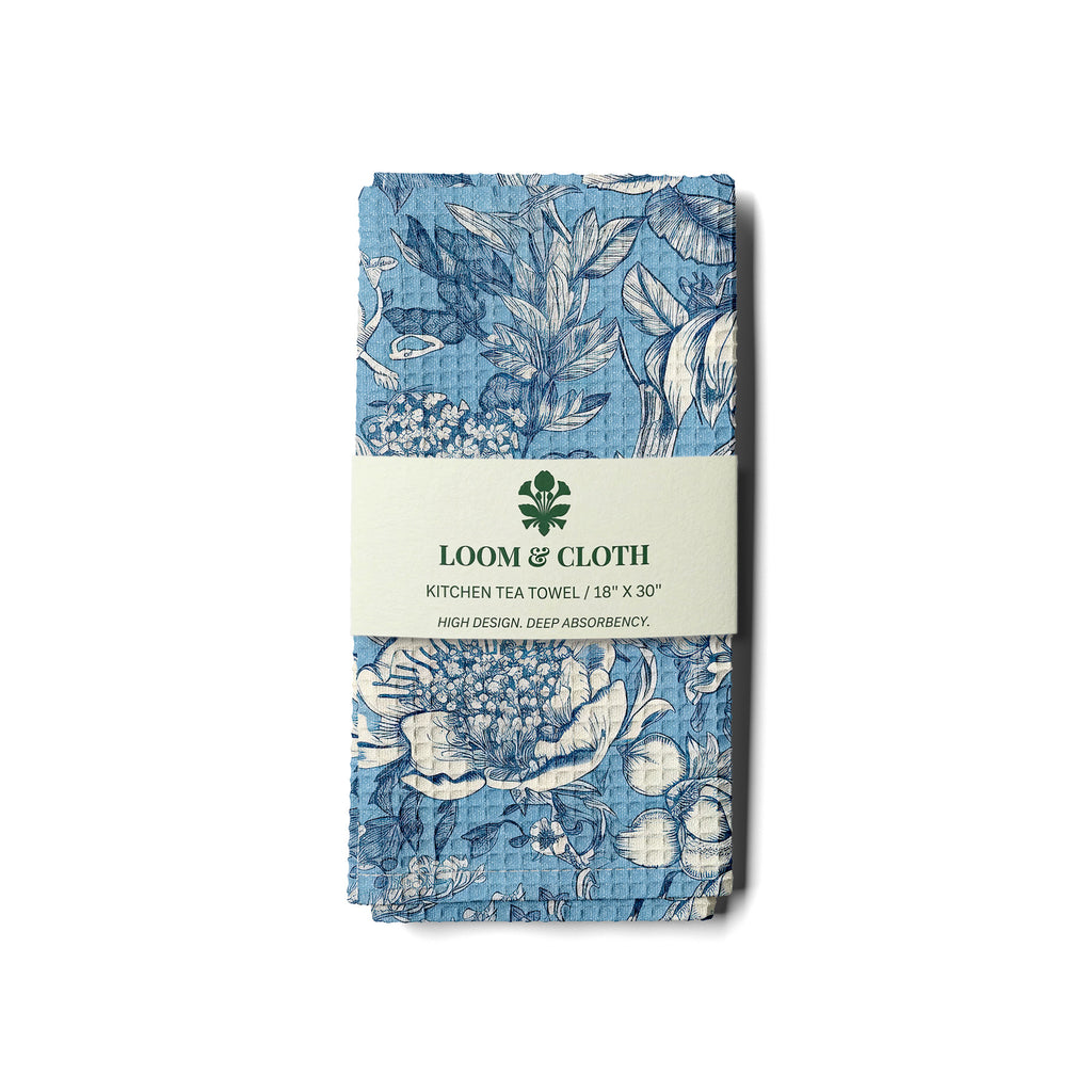kitchen tea towel with a floral design on a white background