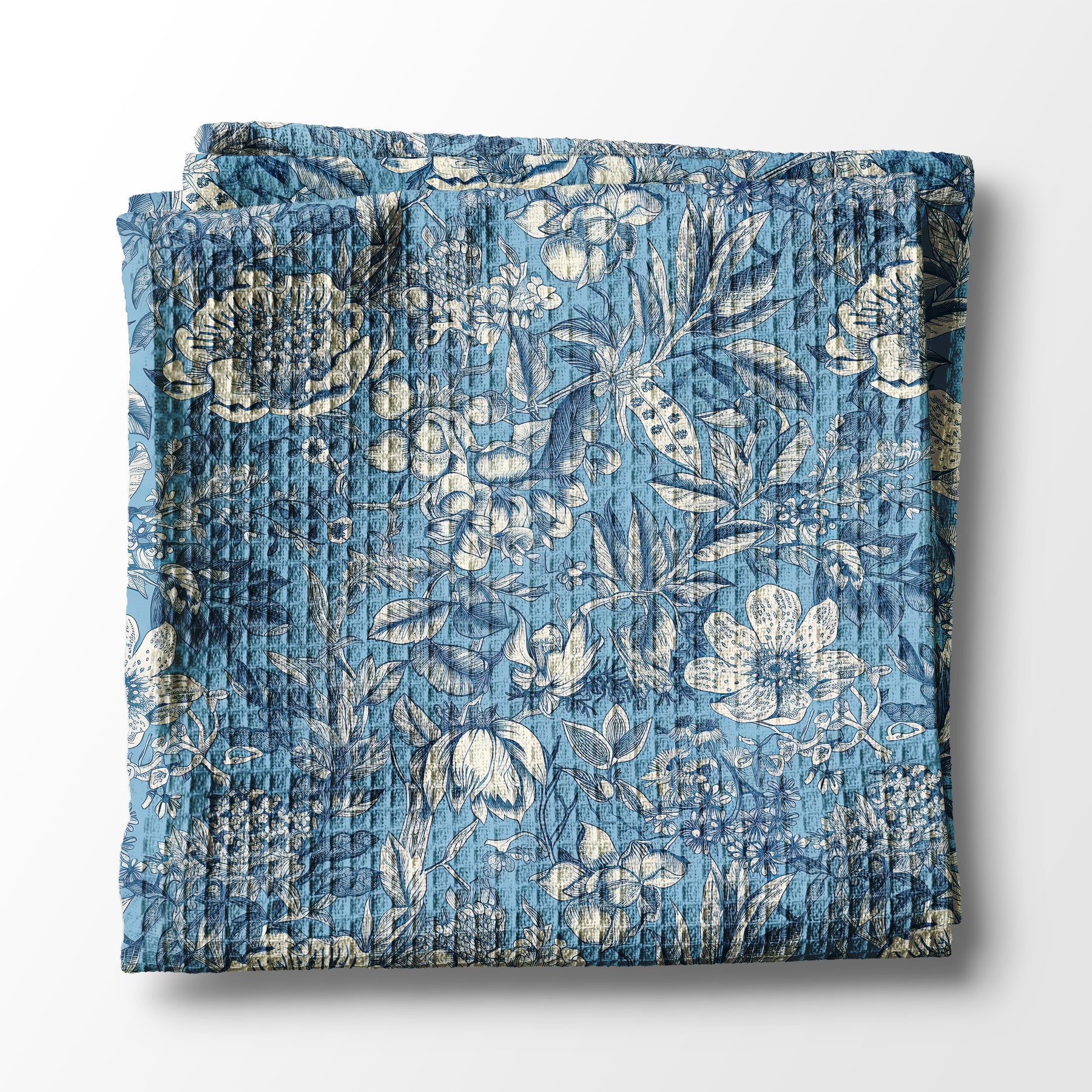 Blue floral kitchen towel on a white background