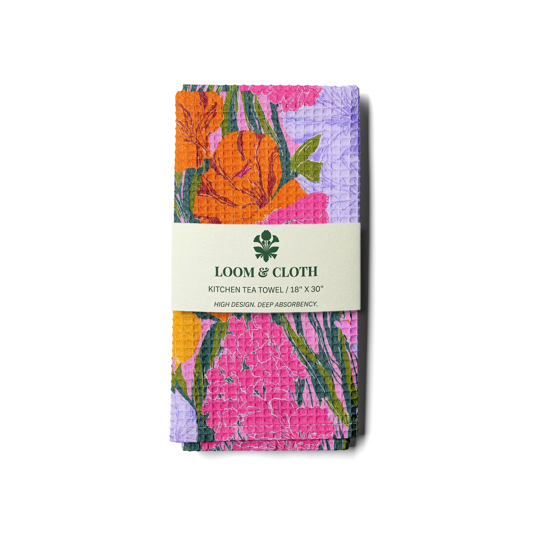 kitchen tea towel with colorful floral pattern and 'Loom & Cloth' branding on a white background.