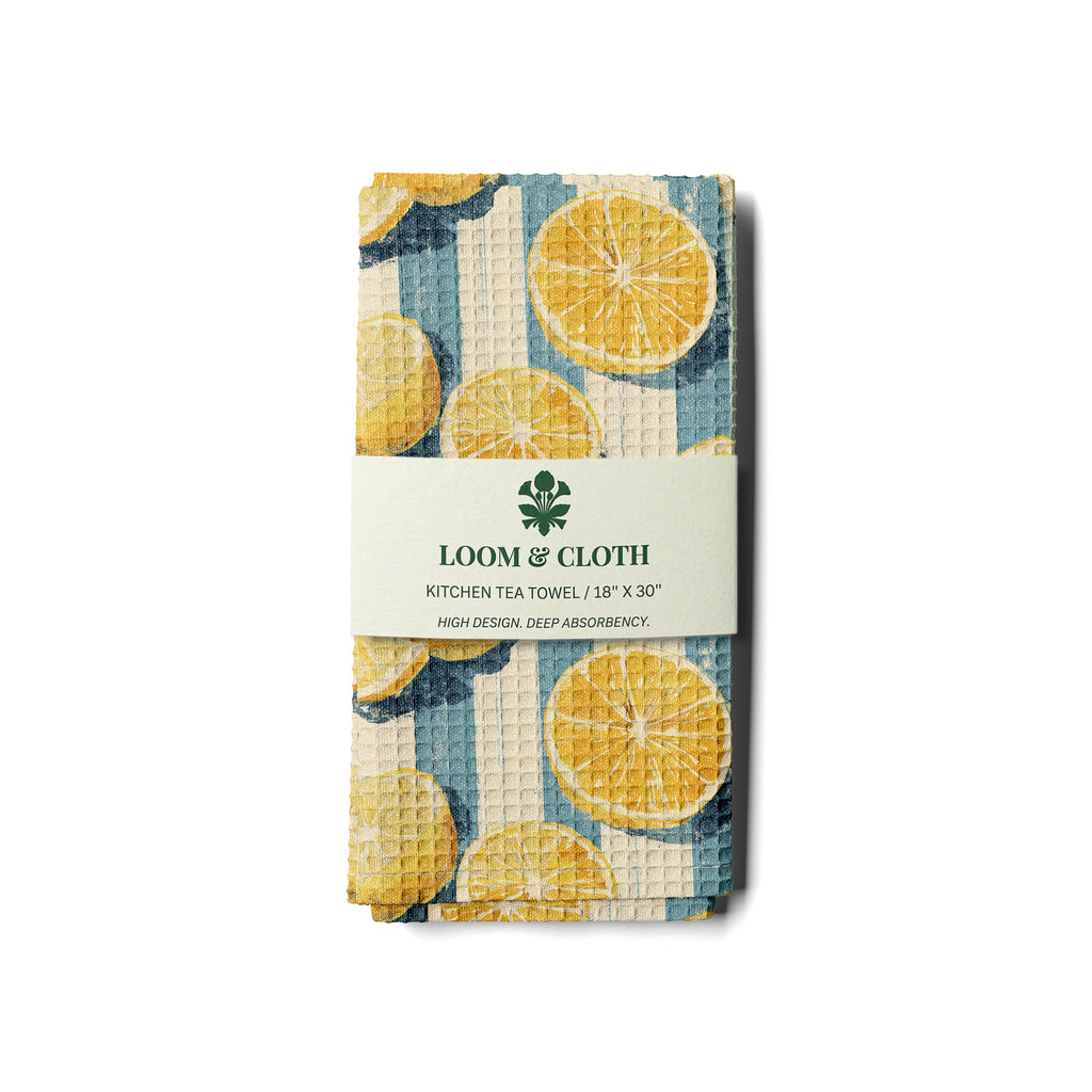 kitchen tea towel with lemon and stripes design on a white background