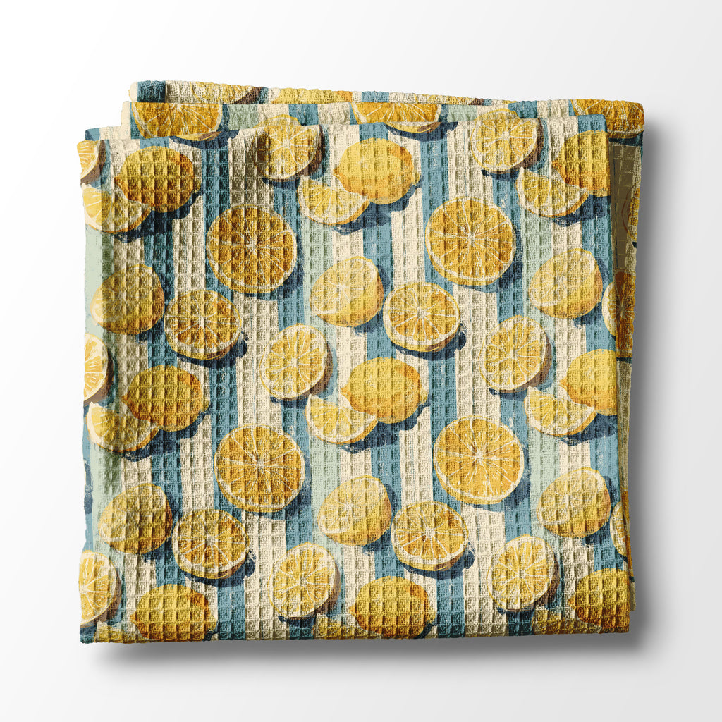Waffle-textured kitchen towel with yellow circular pattern on a white background