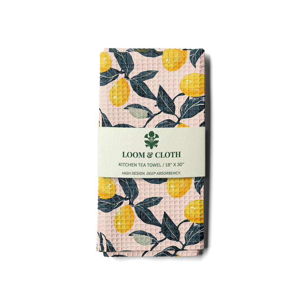 kitchen tea towel with lemon pattern on a white background