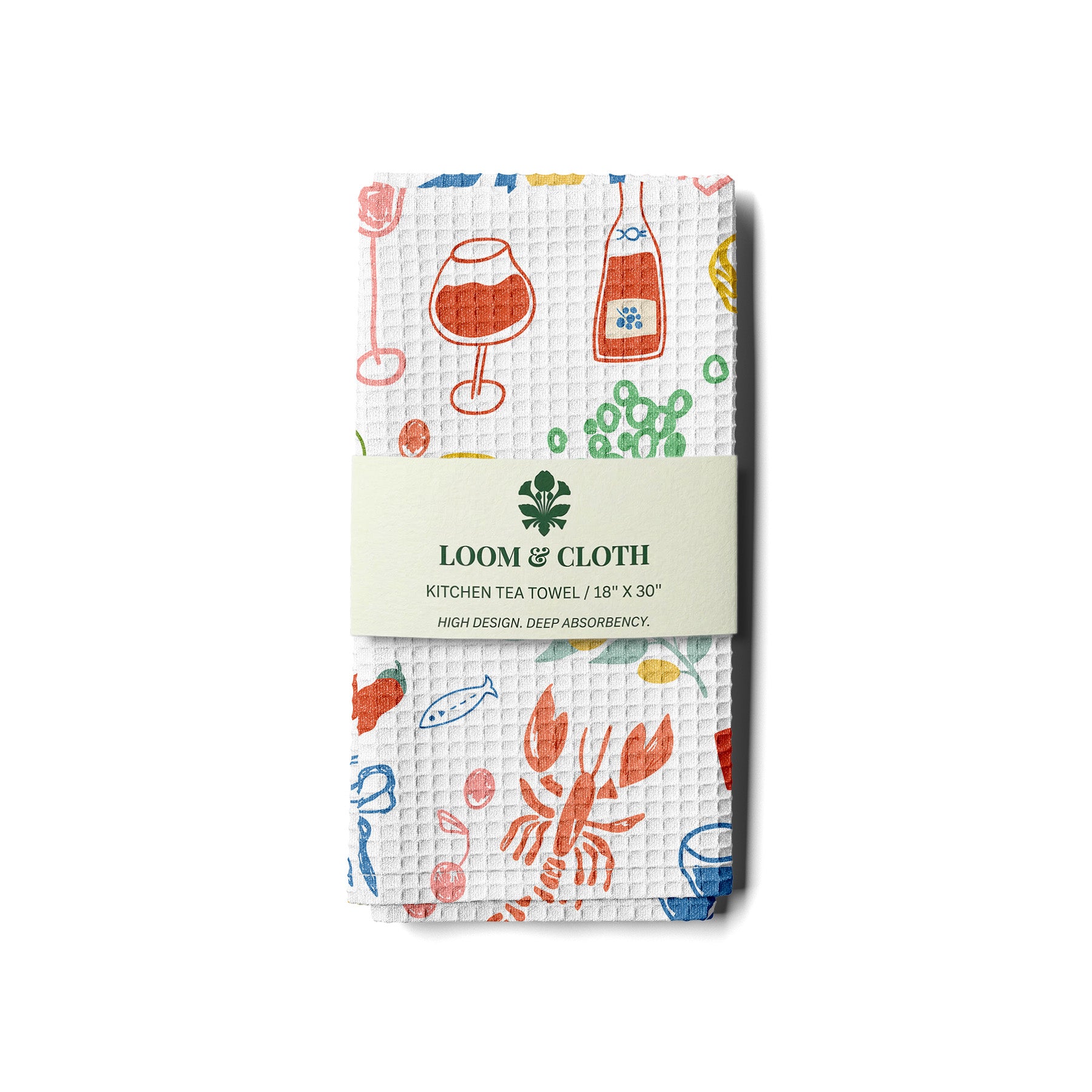 Packaged kitchen tea towel with colorful designs on a white background