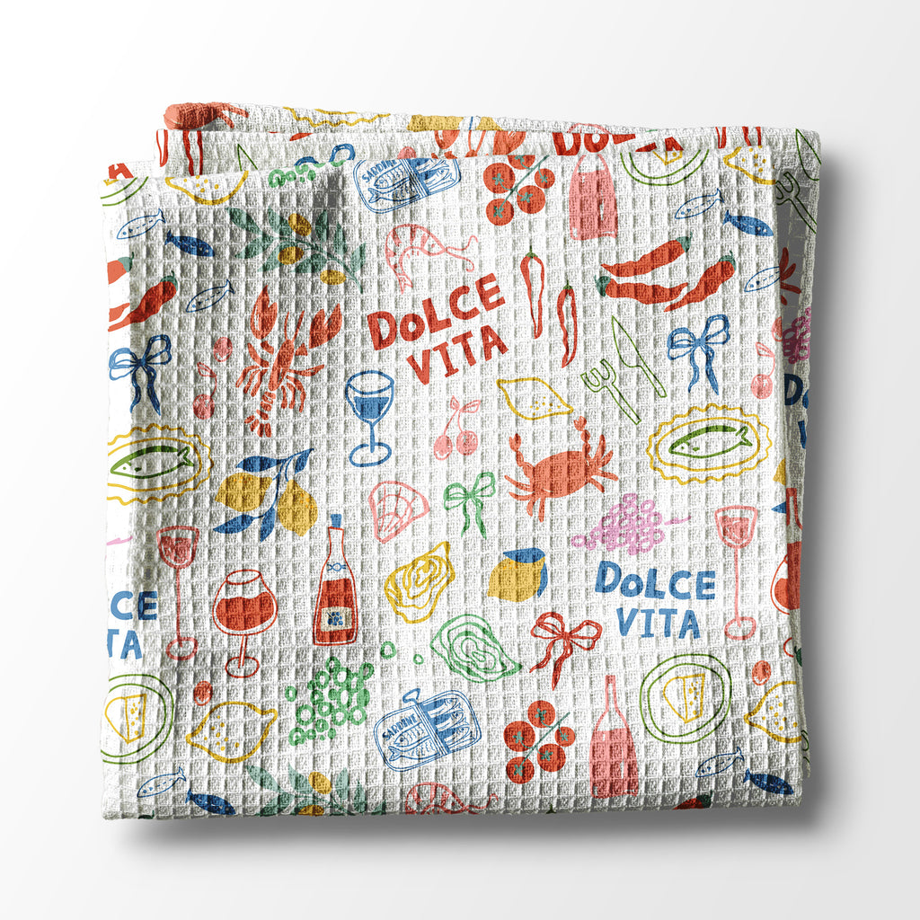 kitchen towel with colorful Italian-themed design and 'Dolce Vita' text on a white background