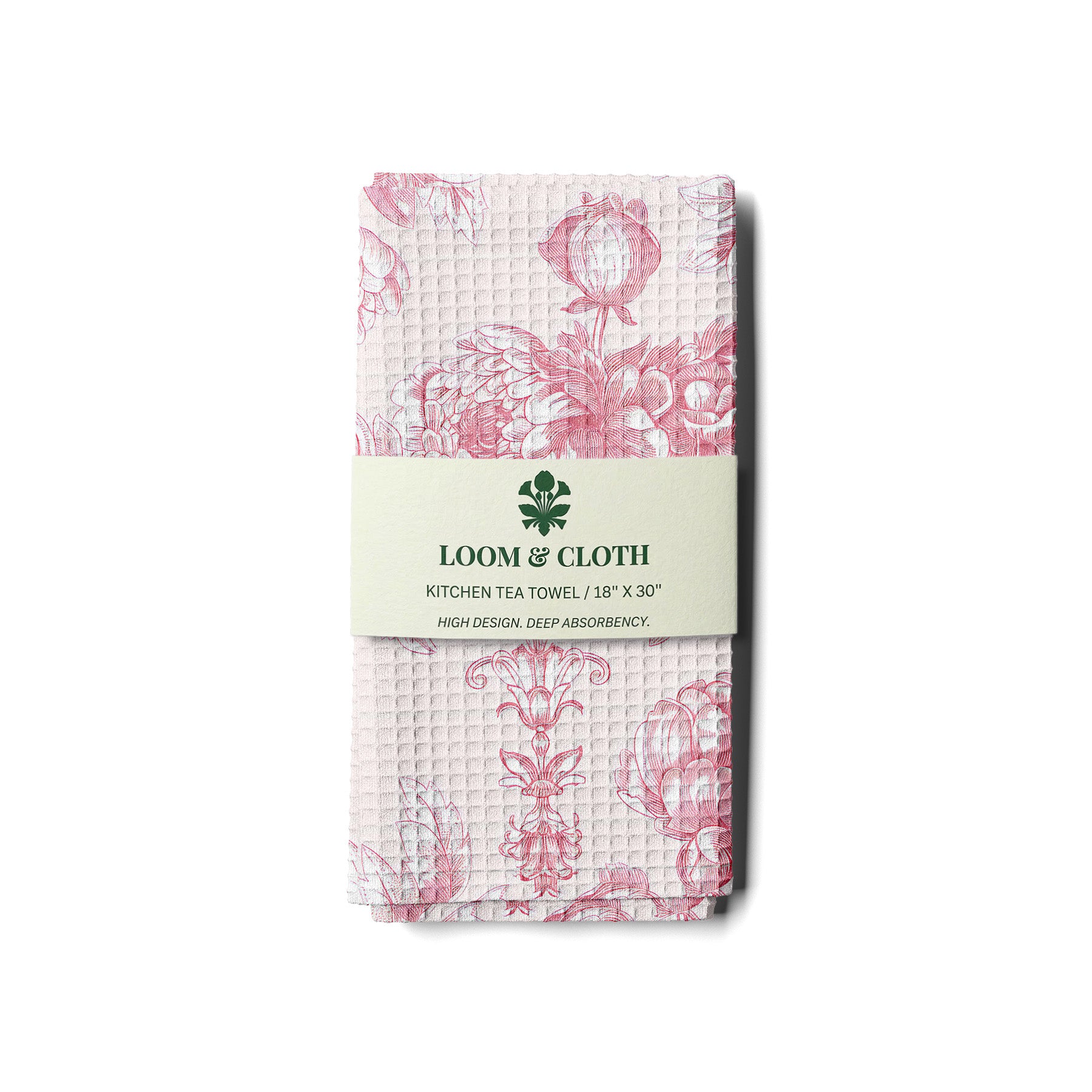 Packaged kitchen tea towel with floral pattern and Loom & Cloth branding on a white background