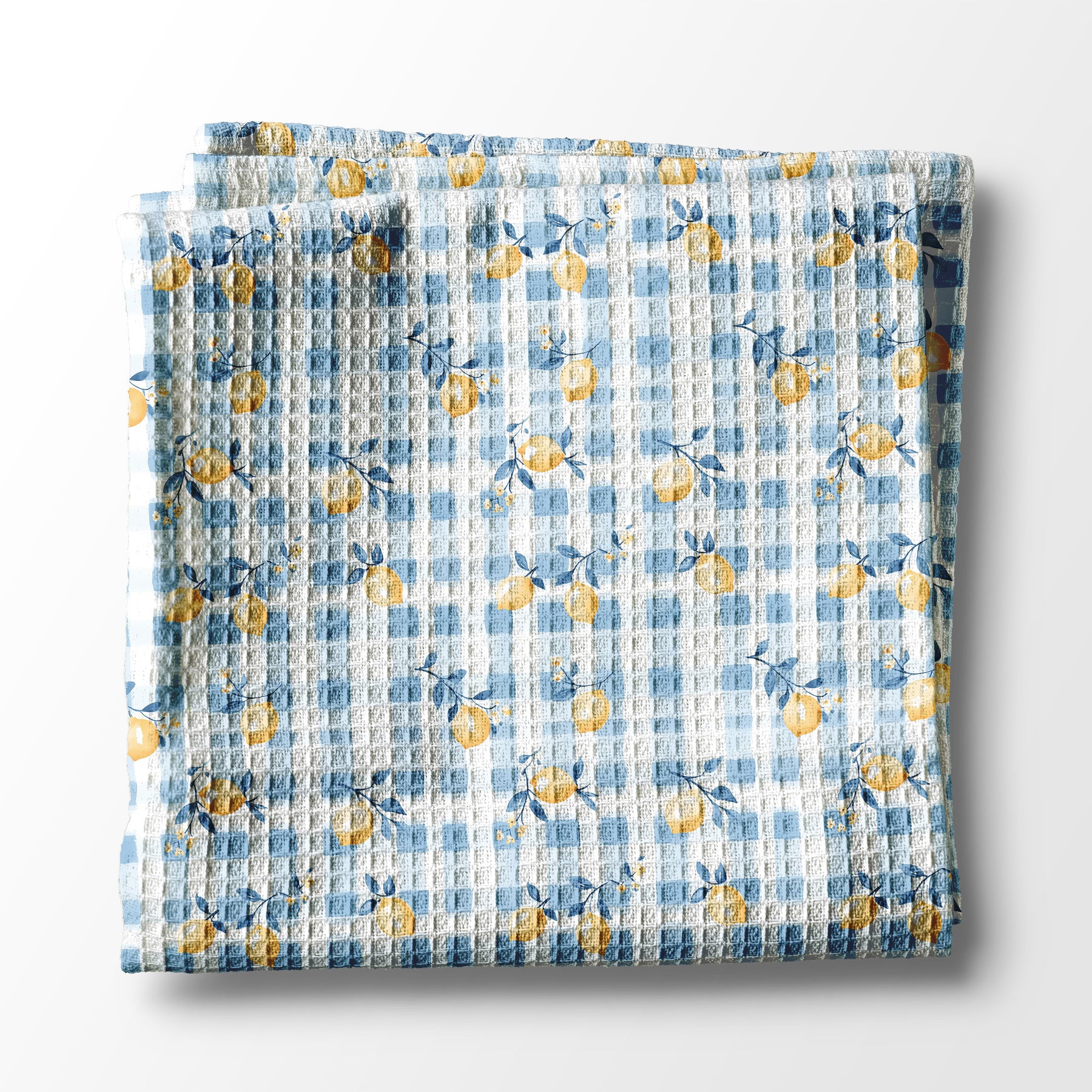 Floral patterned kitchen towel  with blue and yellow flowers on a white background