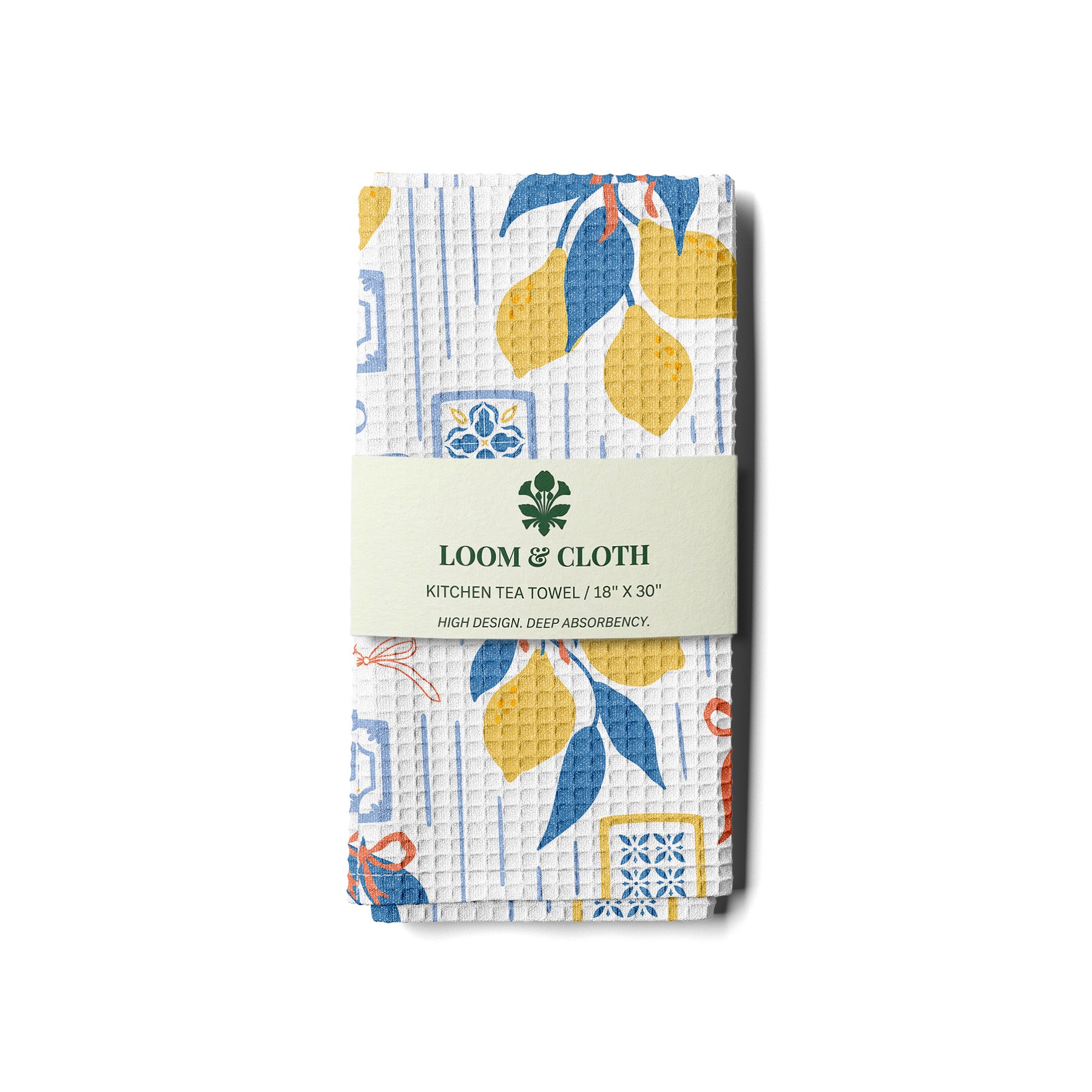 kitchen tea towel with lemon and tile pattern on a white background