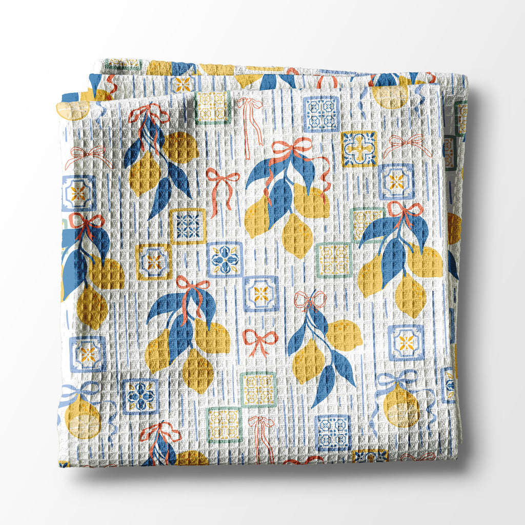 Folded kitchen towel with decorative pattern on a white background