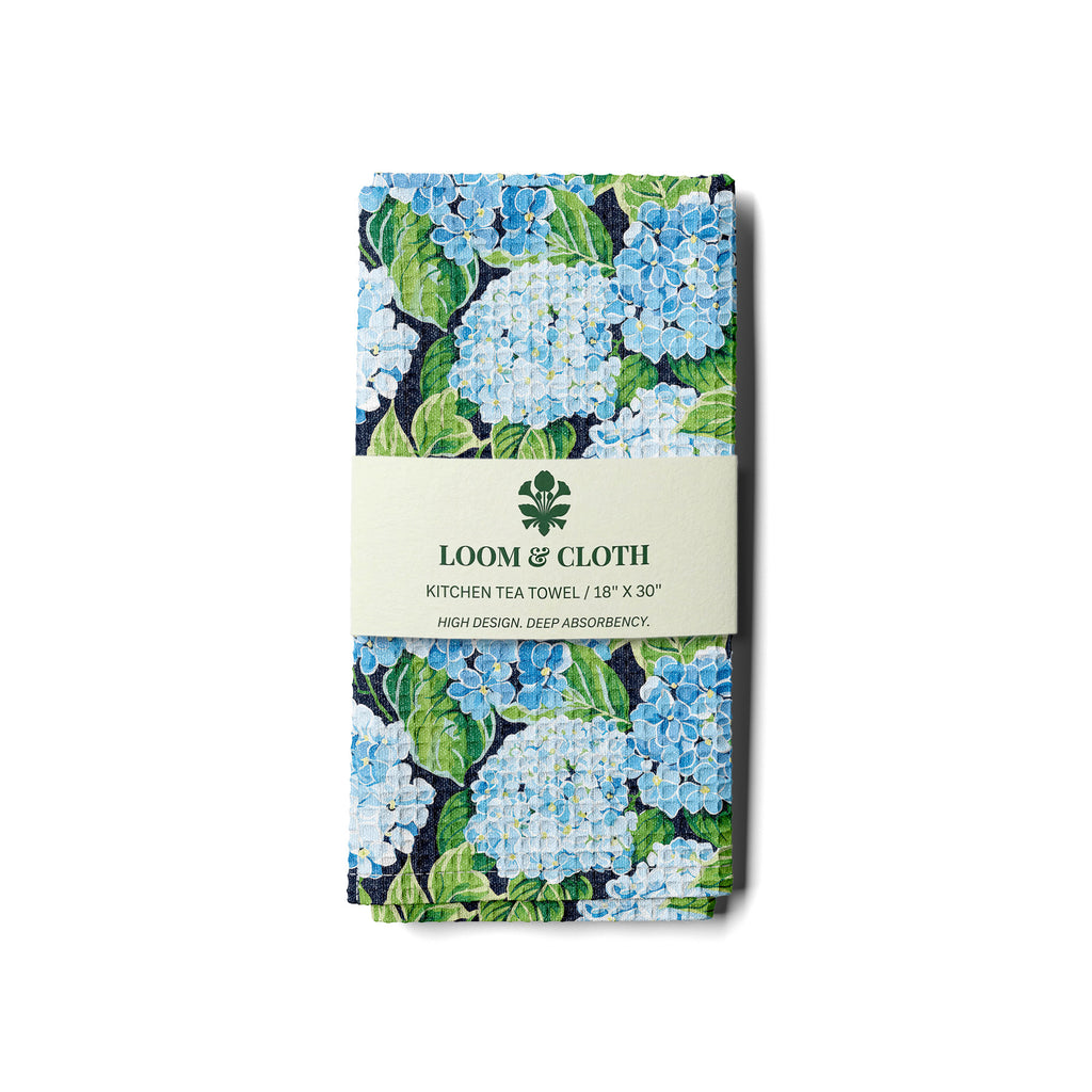 kitchen tea towel with floral design and 'Loom & Cloth' branding on a white background