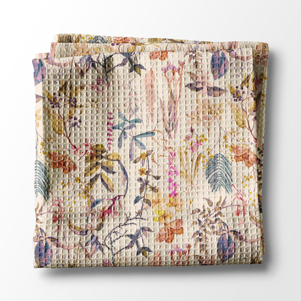 Floral patterned kitchen towel on a white background