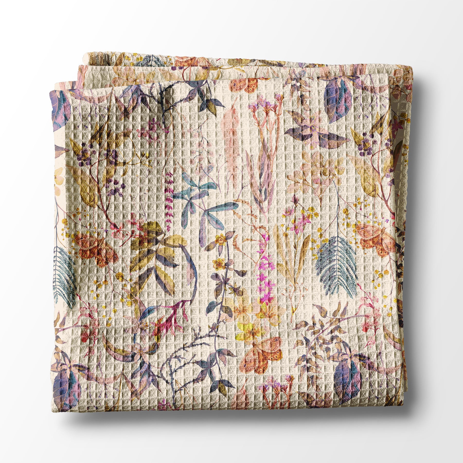 Floral patterned kitchen towel on a white background