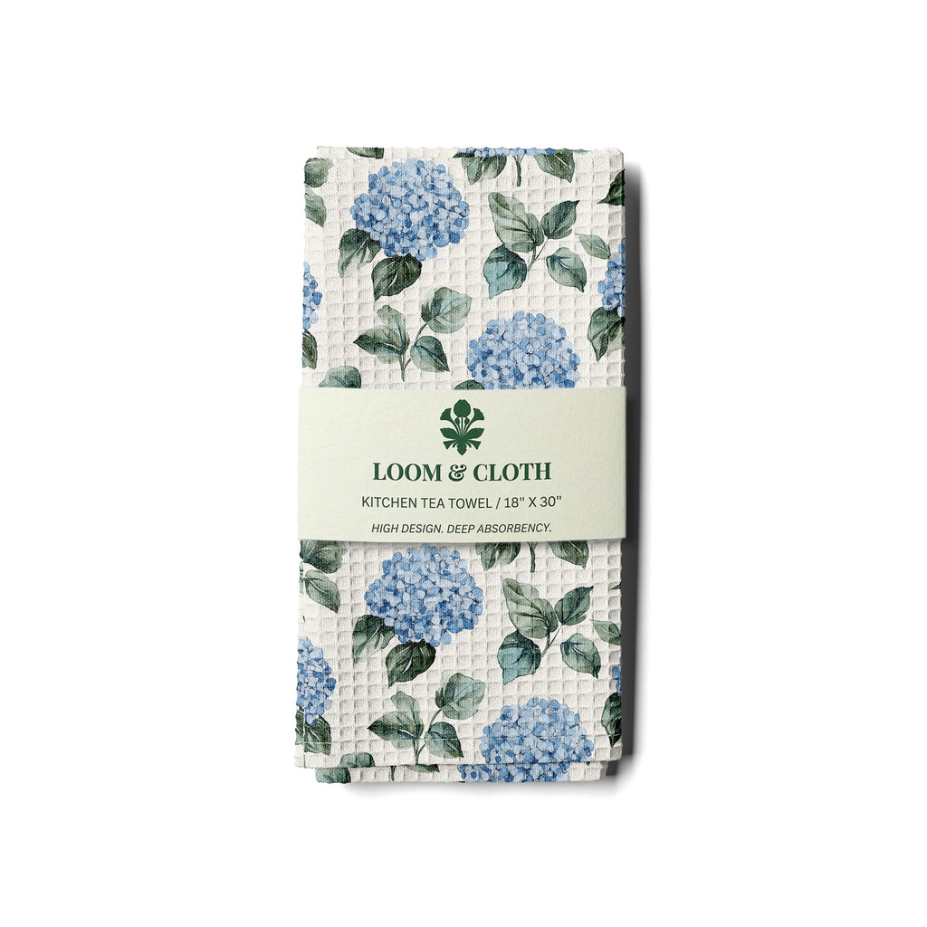 kitchen tea towel with blue floral design on a white background