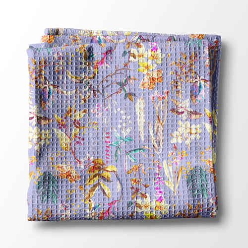 Floral-patterned kitchen towel on a white background