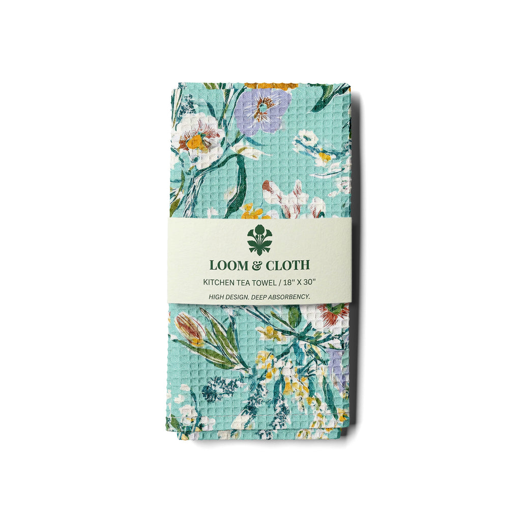 kitchen tea towel with floral design on a white background