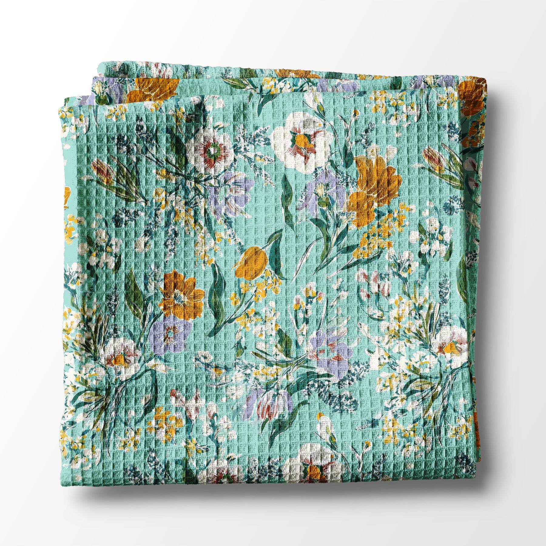 Floral kitchen towel with a waffle texture on a white background