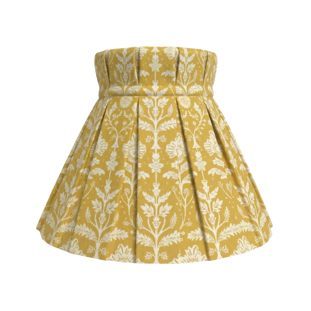 Delia Gold pattern on a lampshade cover on a white background