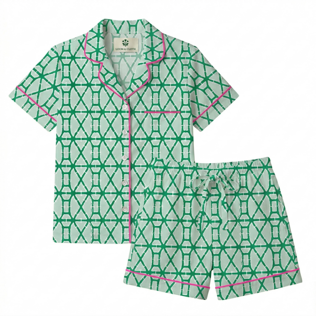 Green and white patterned pajama set with pink accents on a white background