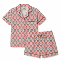 Pink floral pajama set on a white background