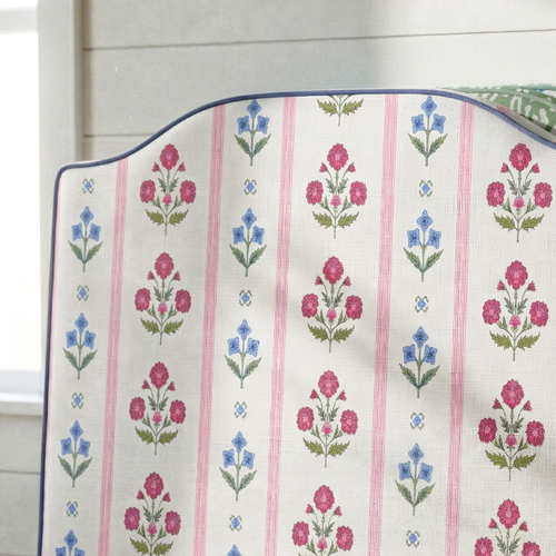 Floral patterned fabric with pink and blue flowers on a white background