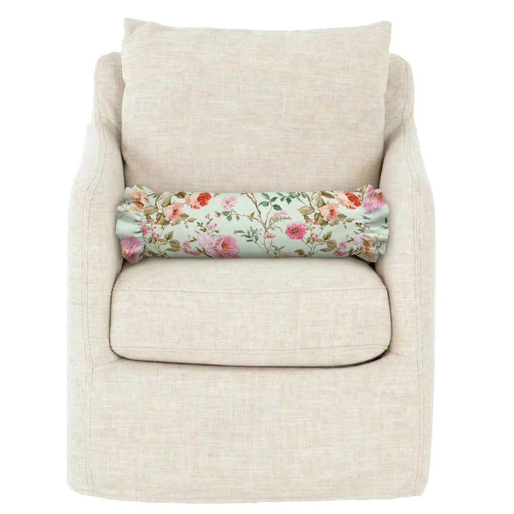 Beige armchair with a floral-patterned cushion on a white background