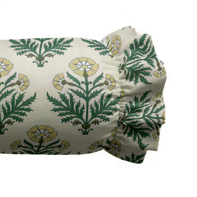 Folded fabric with green and yellow floral pattern on a white background