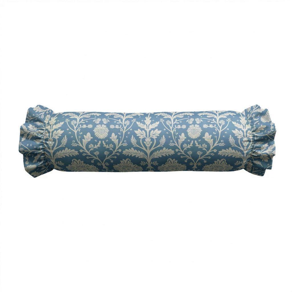 Blue cylindrical pillow with floral pattern on a white background