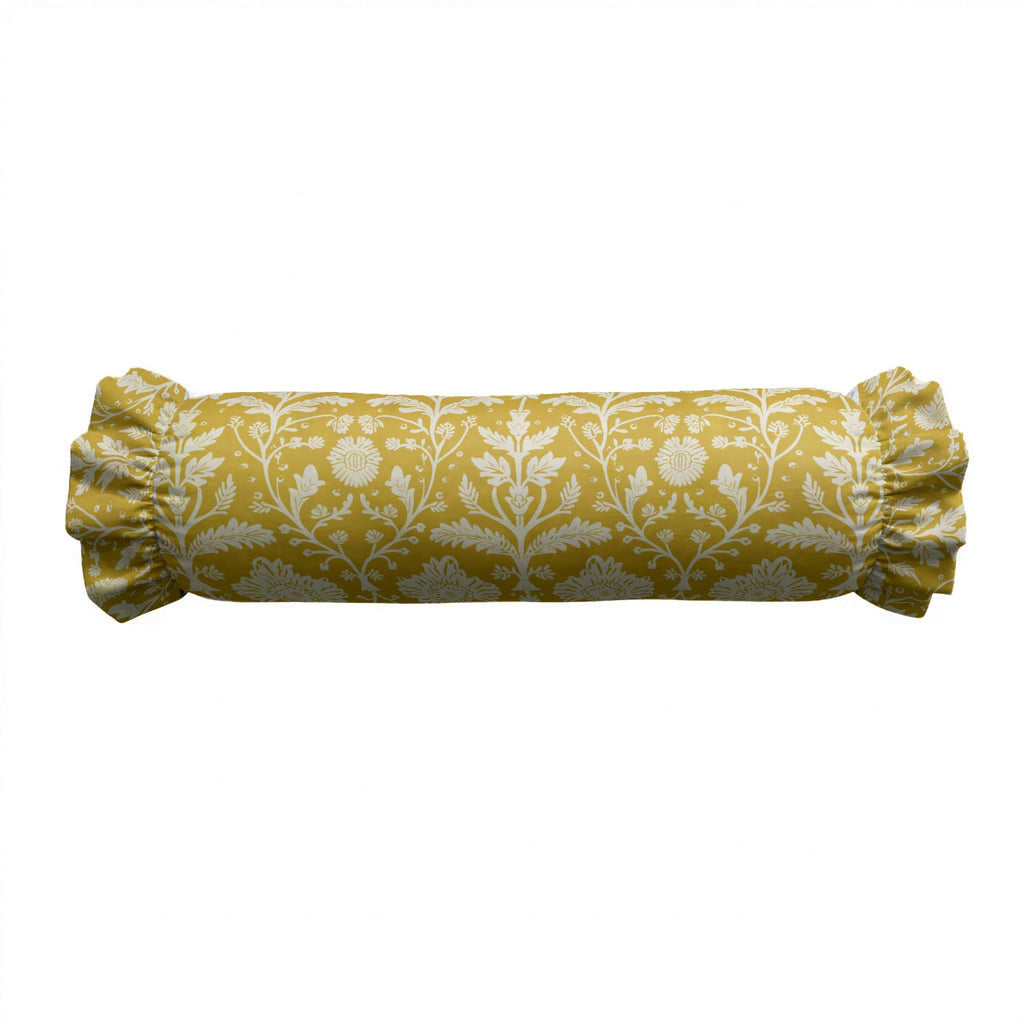 Yellow cylindrical pillow with white floral pattern on a white background