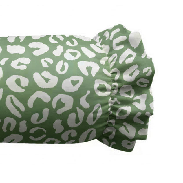 Green fitted sheet with white leopard print pattern on a white background