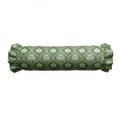 Green cylindrical pillow with white floral pattern on a white background