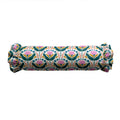 Rolled-up fabric with floral pattern on a white background