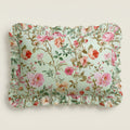 Rosie floral patterned lumbar pillow with ruffled edge on a light background