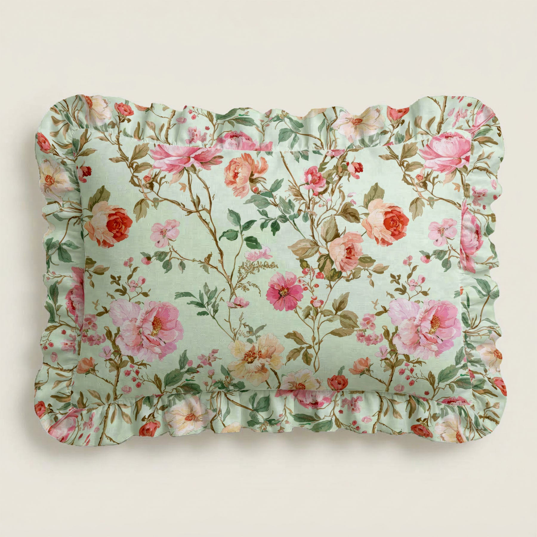Rosie floral patterned lumbar pillow with ruffled edge on a light background