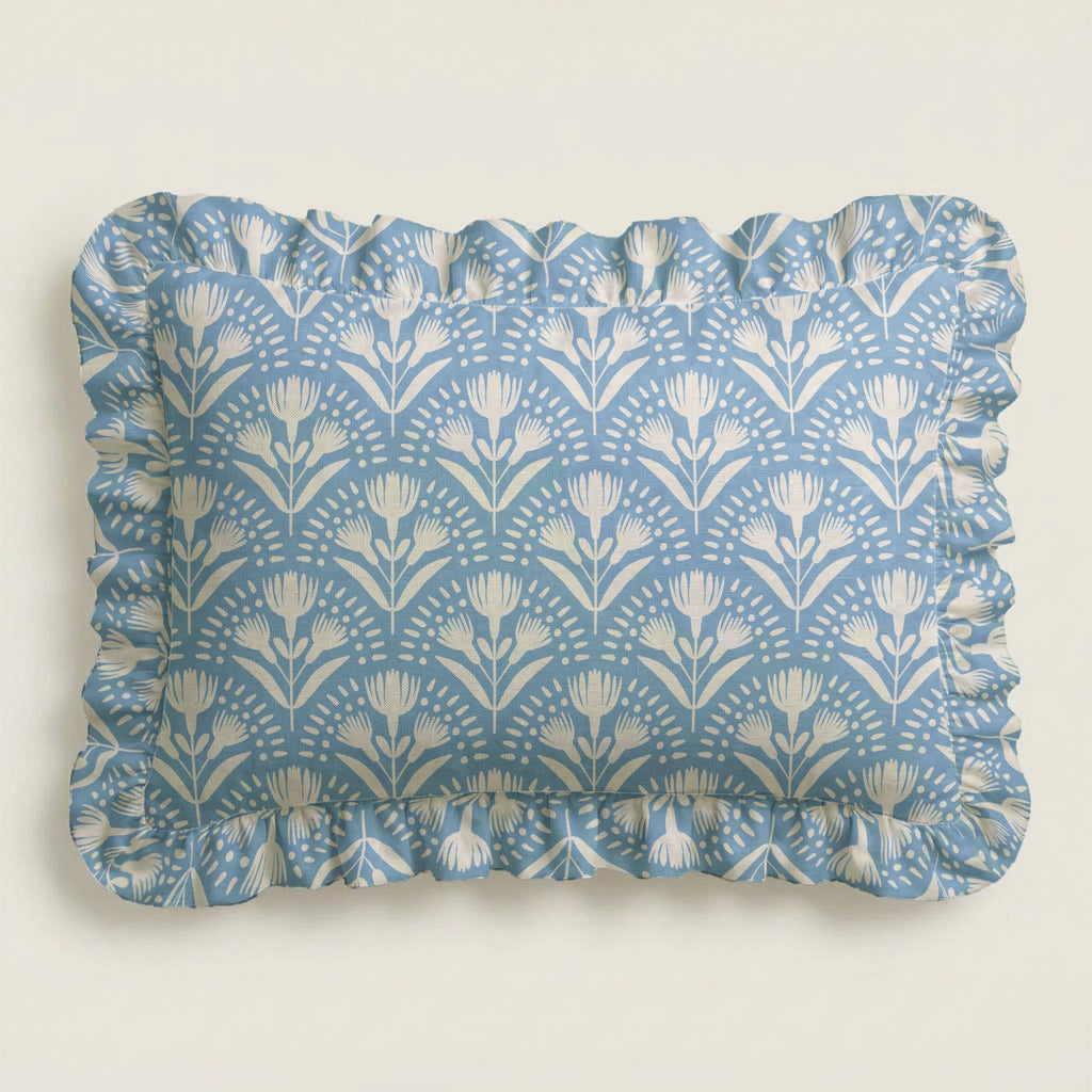 Rectangular tray with blue floral pattern and ruffled edge on a light gray background