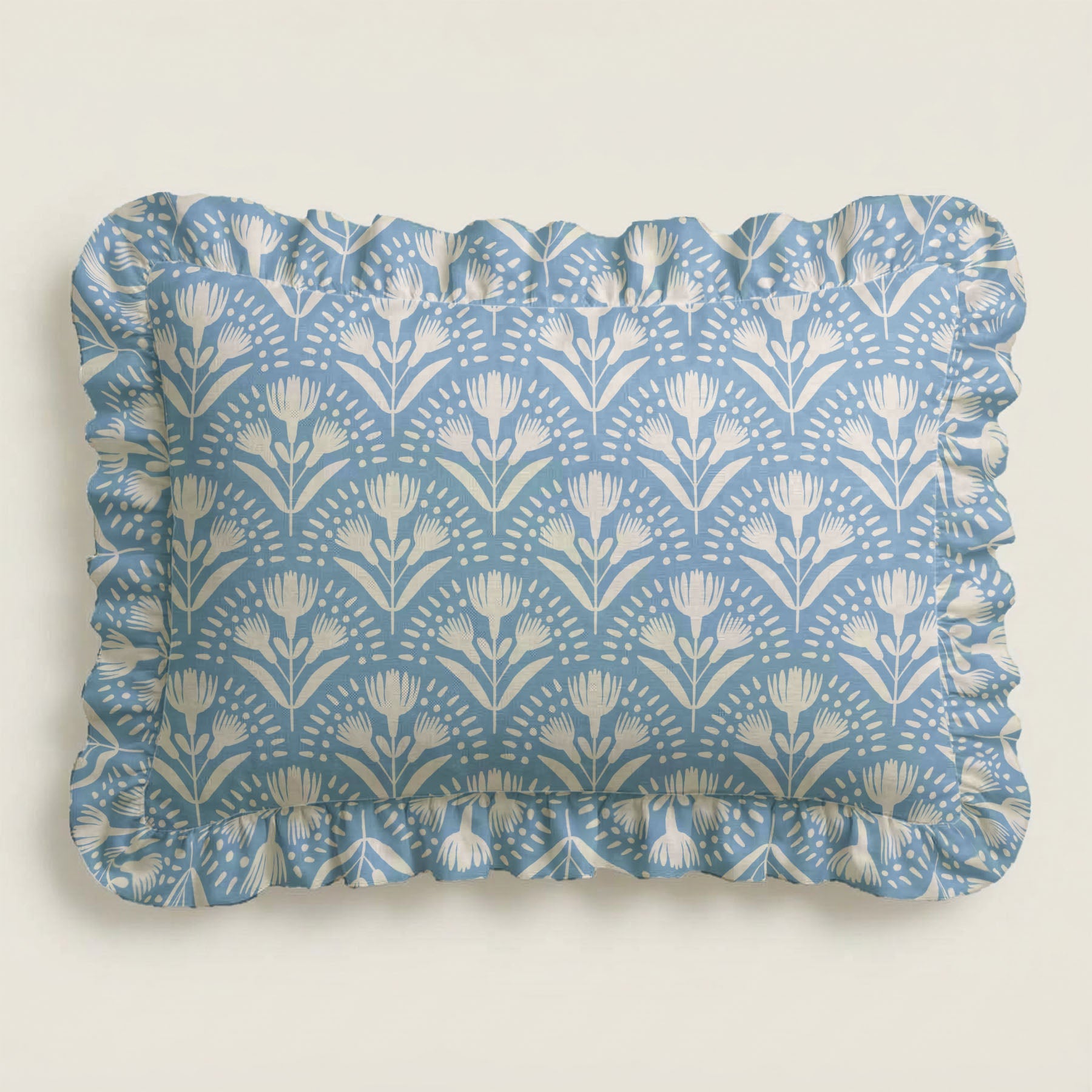 Rectangular tray with blue floral pattern and ruffled edge on a light gray background