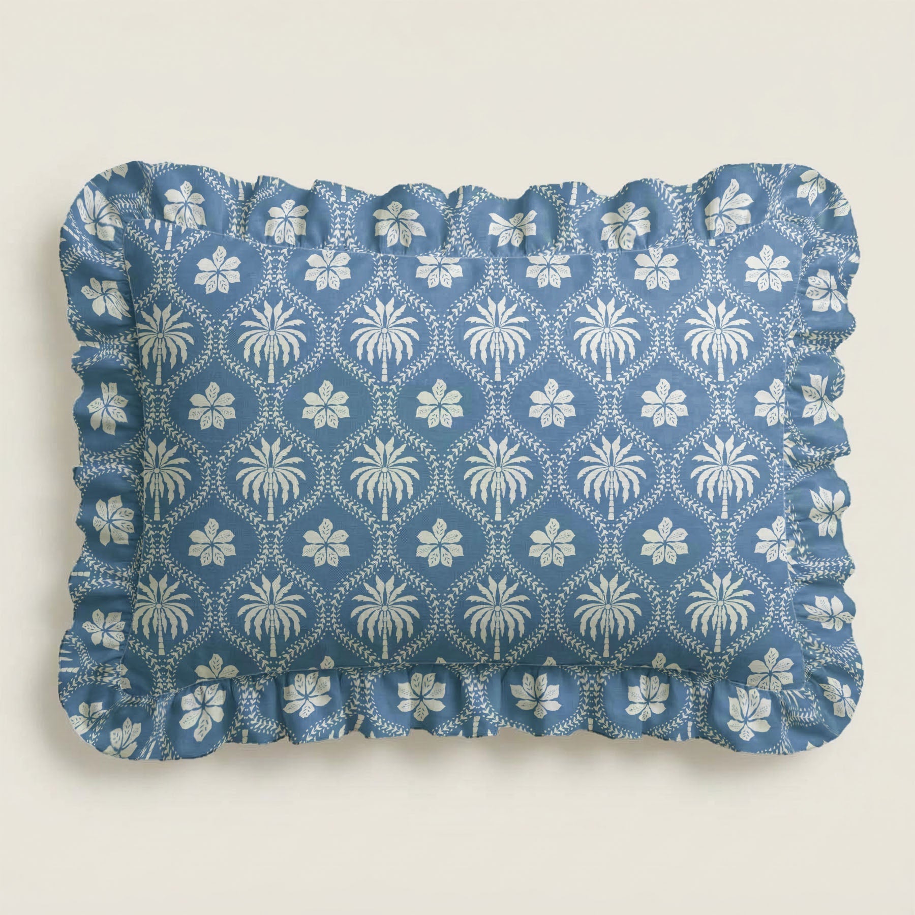 Blue fabric placemat with white floral pattern on a light gray background