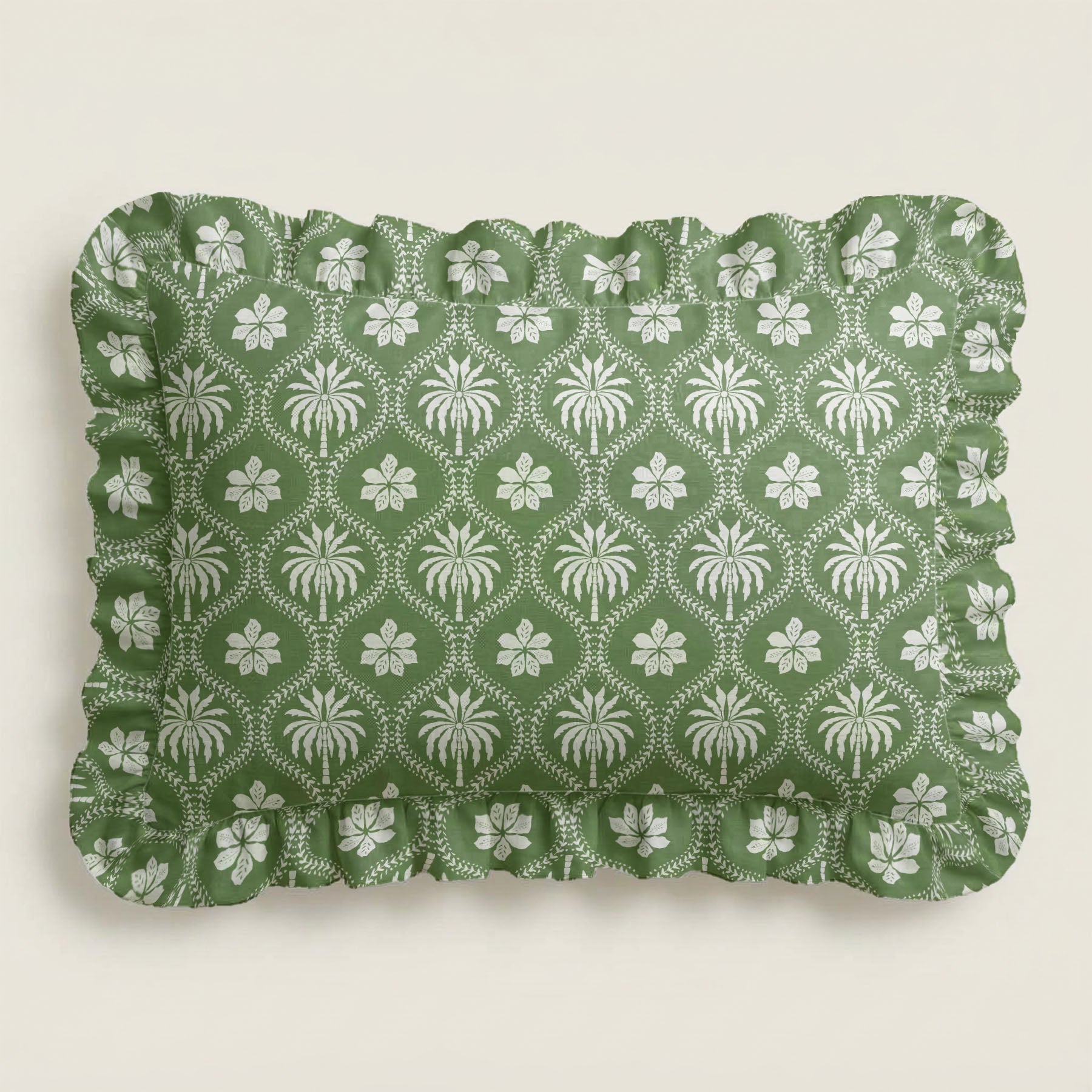 Green fabric with white floral pattern on a beige background