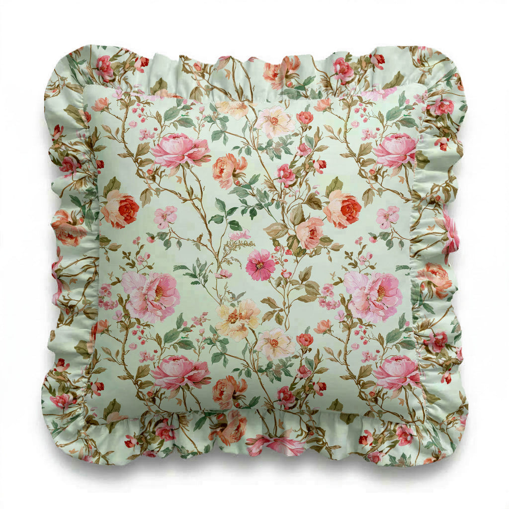 Rosie floral patterned square pillow with ruffled edge on a light background