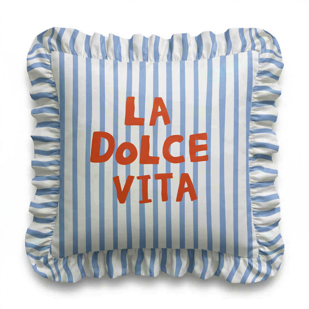 Striped pillow with 'La Dolce Vita' text on a white background