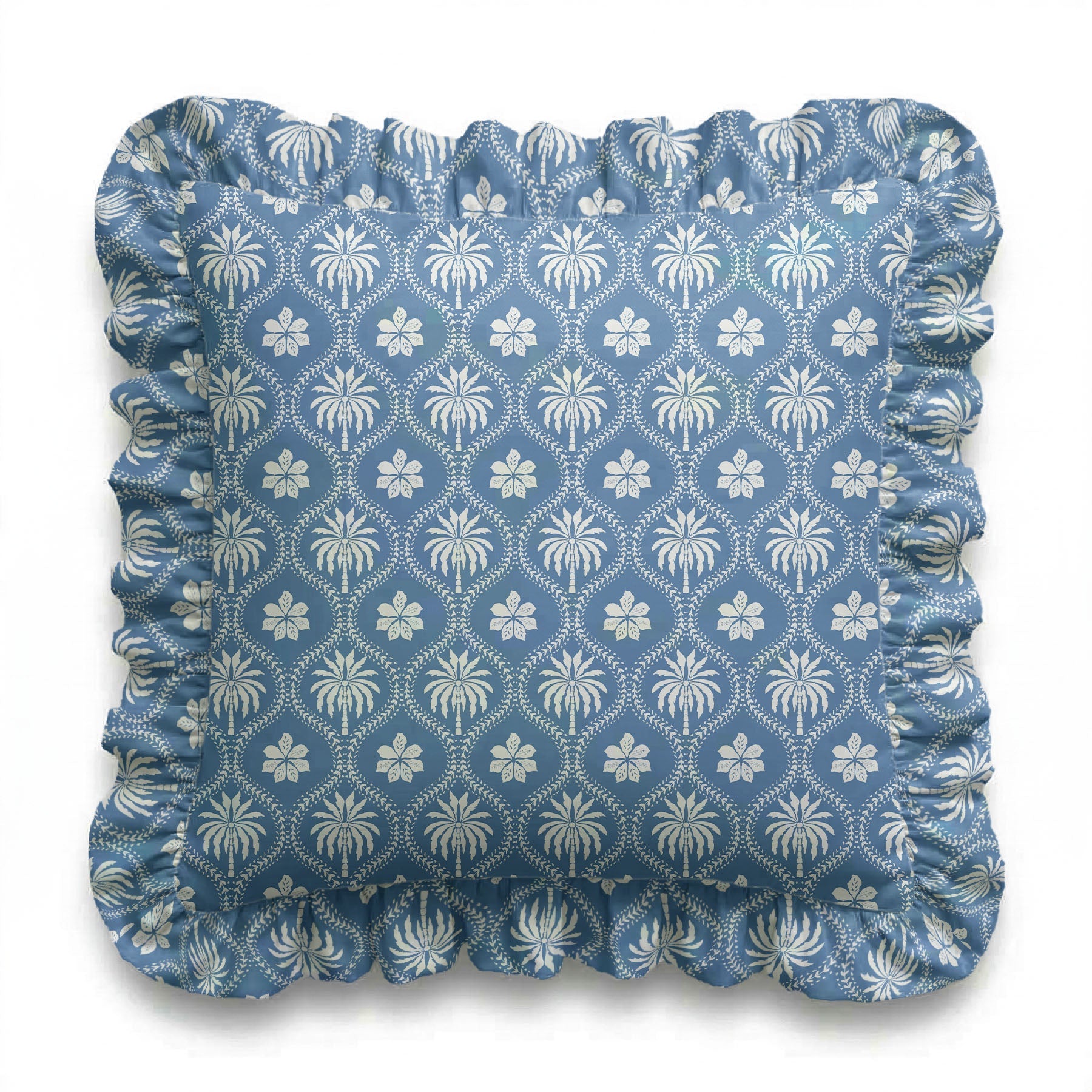 Blue cushion with white floral pattern on a white background