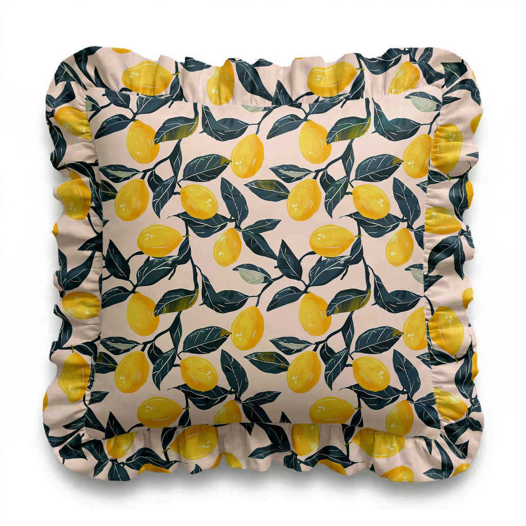 Decorative pillow with lemon and leaf pattern on a white background