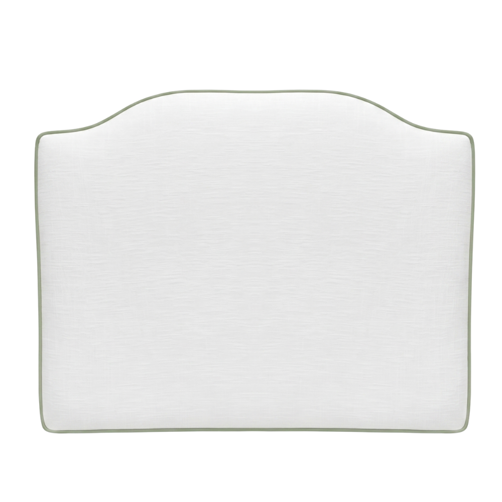 White headboard with green piping on a light background