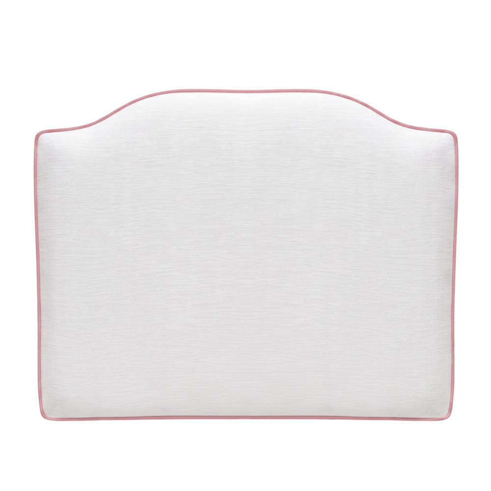 White headboard with pink piping on a light background