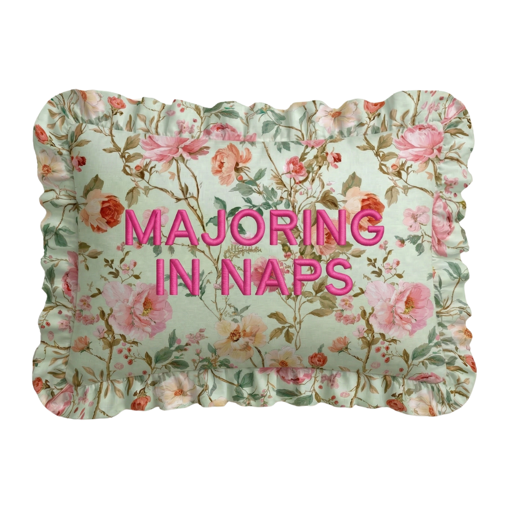 Floral pillow with 'MAJoring in Naps' text on a white background