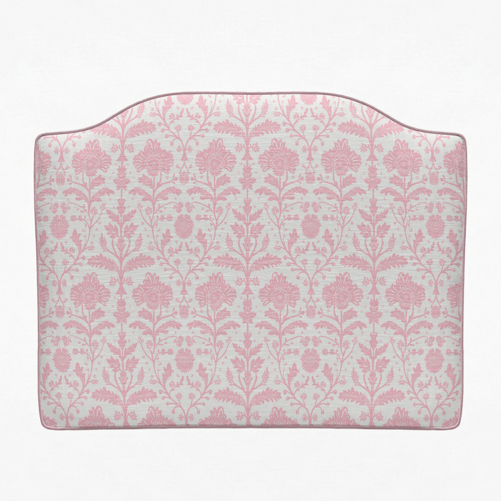 Pink floral patterned headboard on a white background